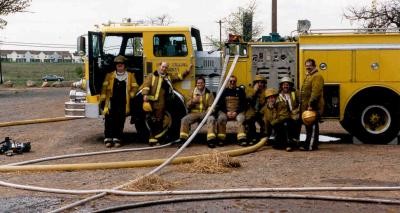 Group Photo At Training Exercise; 1976 Hahn HCP 15 Pumper (W11) First brand new Pumper, painted yellow purchased 4/25/1975, Sold 1/19/1991 to Smithfield Township VFD, PA 
